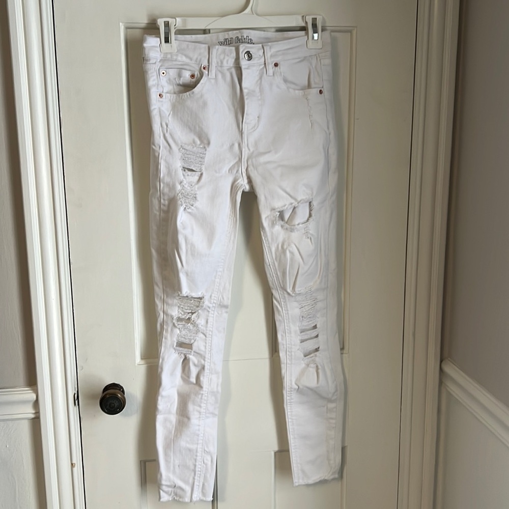 White size 2 skinny, distressed jeans. In great condition.